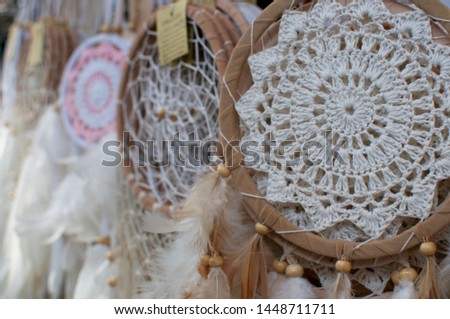 Close up picture of many dreamcatcher hanging at a market stall in the Love Anchor market in Canggu, Bali - Indonesia
