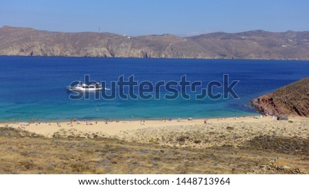 Photo from tranquil and famous small cove and sandy beach of Agios Sostis, Mykonos island, Cyclades, Greece