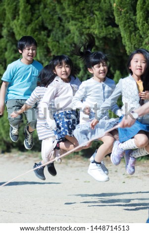 
Elementary school student doing skipping rope