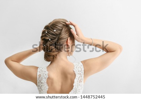 Beautiful young bride on white background