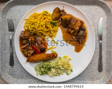 Spaghetti with tomato sauce, grilled beef steak, Salad on plate, top view. Delicious balanced food concept