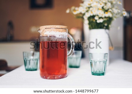 compote and glass glasses on a table, lemonade from berries