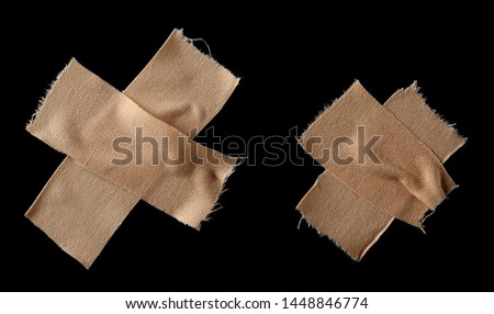 Adhesive bandage, first aid isolated on black background, top view with clipping path