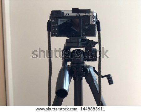 the close up of camera and tripod amateur set