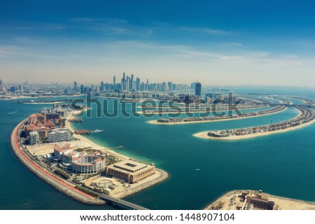 Aerial view on Palm Jumeira island in Dubai, UAE, on a summer day. Royalty-Free Stock Photo #1448907104