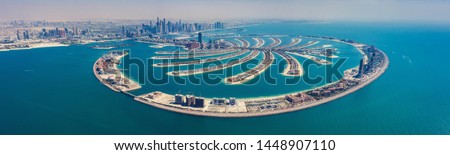 Aerial view on Palm Jumeira island in Dubai, UAE, on a summer day. Royalty-Free Stock Photo #1448907110
