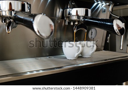 Close up of modern beautiful coffee machine with vintage style black and chrome metal texture design. Macro shot of coffee making equipment. Copy space, background.