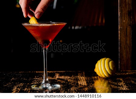 Manhattan or old fashioned. Classic American cocktail, made with rye whiskey bitters shaken and strained into a martini glass and garnished with a bourbon soaked cherry and lemon peel.