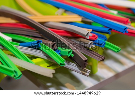 Variety of colored extruded rubber profile (seal). Industry Royalty-Free Stock Photo #1448949629