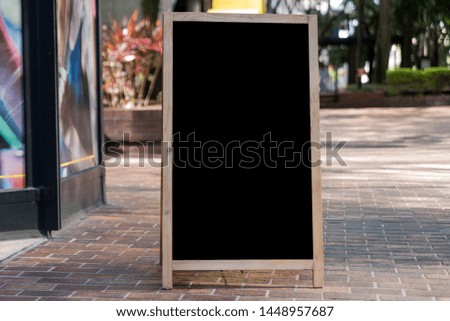 Blank Chalkboard Sign on a City Sidewalk