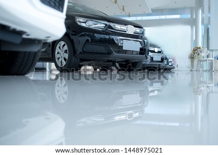 White floor for new car parking, new car pictures in the showroom, park, show waiting for sales of branch dealers and new car service centers.