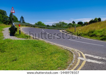 Country road with road sign warning traffic to watch out for Pedestrian's 