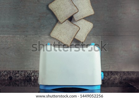 four toast entering the toaster
