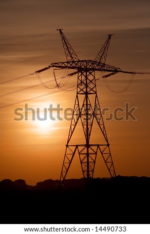 High-voltage tower on a sunset