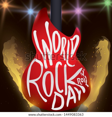 Stage with the back of a red guitar in a presentation with flamethrowers and colorful lights to celebrate World Rock 'n' Roll Day.