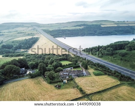 Aerial view of the M62 heading towards Leeds with the Scammonden reservoir to the right, Calderdale, West Yorkshire