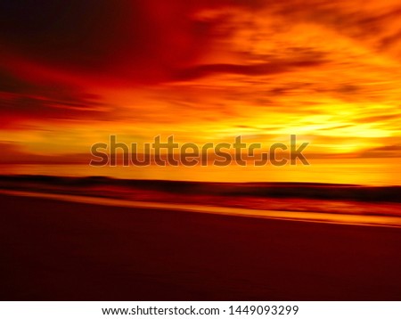 Blurred photo,Abstract beautiful seascape with motion blur sky and sea at dramatic colorful sunset.Background concept.Composition of nature
