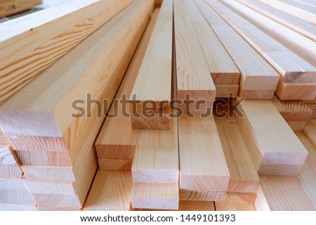 Glued pine timber beams for wooden windows closeup Royalty-Free Stock Photo #1449101393