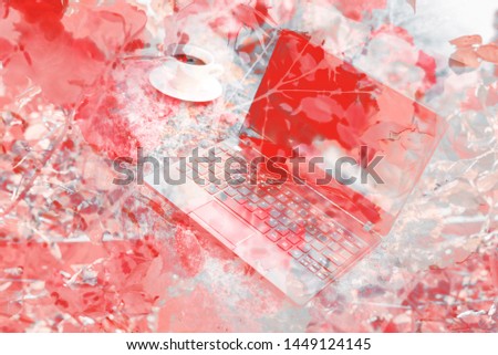 Floral graphics in red, coral and blue colors with view of 
laptop and cup of coffee