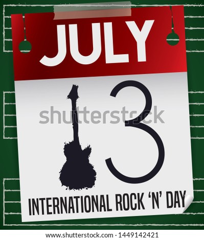 Blackboard with music staff chalk drawings and a loose-leaf calendar with guitar silhouette painted like number one to remind the date for International Rock 'n' Roll Day: 13 July.