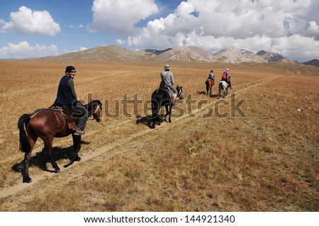 Horse riding trip in high mountain, Kyrgyzstan, Asia