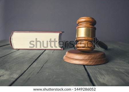 wooden judge with book on the desk
