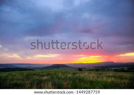 A beautiful Sunny dawn on a rural field in Crimea