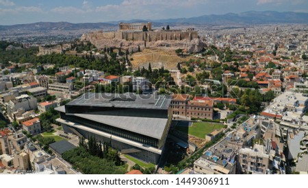 Aerial photo taken by drone of iconic new modern Acropolis museum, Acropolis hill and the Parthenon at the background, Athens historic centre, Attica, Greece Royalty-Free Stock Photo #1449306911
