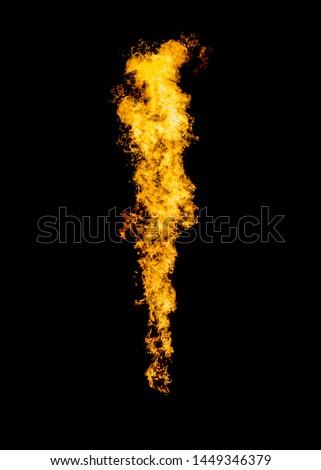 Flame jet goes from gas burner. Isolated fire on black. Royalty-Free Stock Photo #1449346379