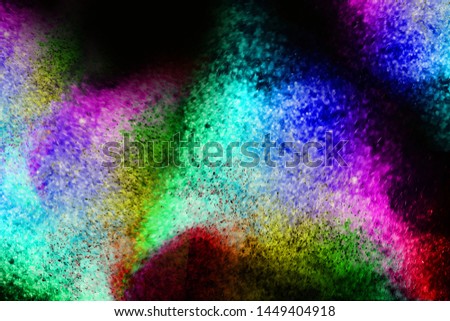 Freeze motion of colored dust explosion isolated on black background