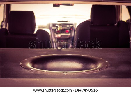 Giant Subwoofer Sound Speaker in the Trunk. Blurred Car Interior. Royalty-Free Stock Photo #1449490616