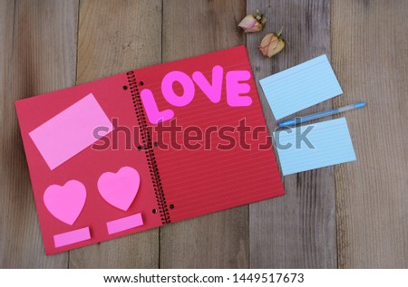 Red Notebook With Flags and Sticky Notes 