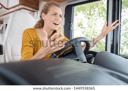 picture of angry blond girl in a van
