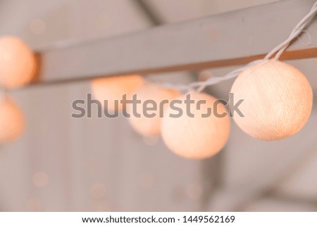 Christmas New Year Background. Hanging Pastel Golden Cotton Balls.