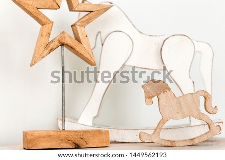 there is a wooden horse and a star on the table