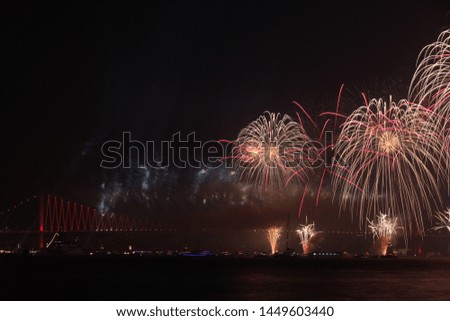 Colorful fireworks at Bosphorus in Istanbul Turkey for the republic, independence day anniversary. Big celebration with the view of Bosphorus Bridge. Happy moments for Turkish people.