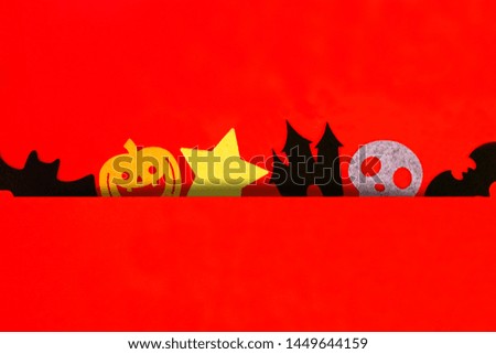 Halloween holiday decorations on red background, Flat lay of Halloween decorations on red, top view copy space, Halloween concept.