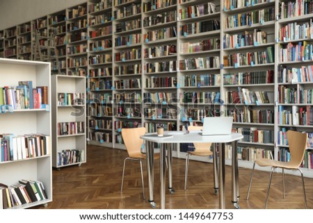 View of bookshelves and table in library