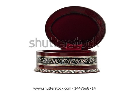 Wooden box with ornaments for jewelry and bijouterie on an isolated white background