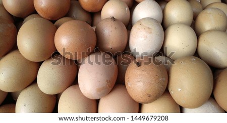 background of fresh eggs for sale at a market.