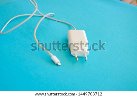 white charger on a blue background