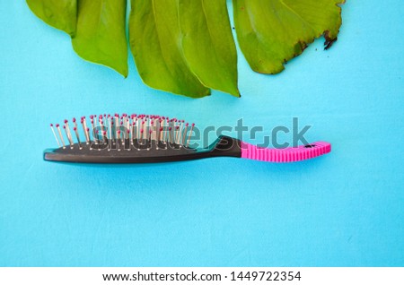 purple comb on a blue background