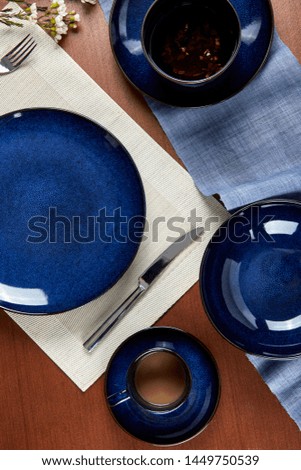 Still life combination photography of blue tableware and cutlery