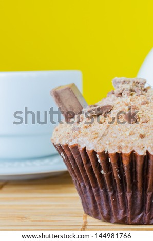 Chocolate cupcake with chocolate stick on top&colorful background