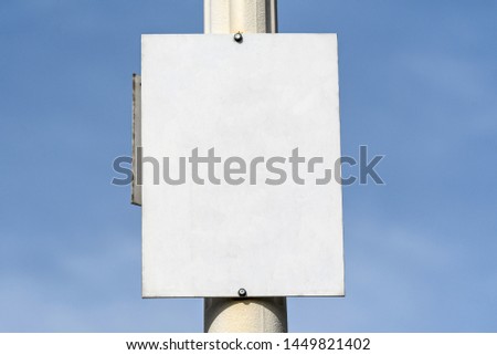 White display fixed on a lightning pole with blue sky in the background, ready for labels

