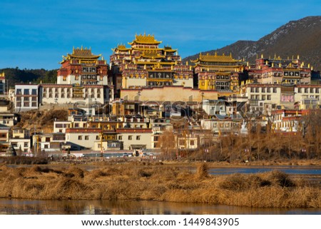 Songzanlin temple in Shangrila, China. There is clear blue sky background. Royalty-Free Stock Photo #1449843905