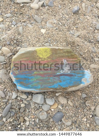 Sea picture with the yacht on a stone