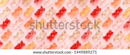 Flat lay composition with delicious jelly bears, jelly bears pattern on pink background, panoramic image Royalty-Free Stock Photo #1449889271