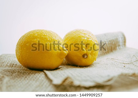 lemon on a brown gunny sack with withe background