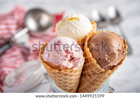 strawberry, vanilla, chocolate ice cream woth waffle cone on marble stone backgrounds Royalty-Free Stock Photo #1449921599
